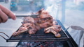 Man Hand Preparing Grilled Chiken Legs, Grilling Meat Barbecue, Outdoors Lifestyle