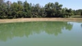 Aerial Footage Around View Of A Pond From The Center
