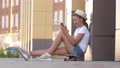 Fashionable Girl Reads Using Modern Technology Smartphones. A Young Millennial