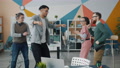 Diverse Group Of Young People Colleagues Dancing In Office Having Fun Together