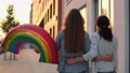 Two Happy Lesbian Woman Lgbt Same-Sex Couple Hugging With Rainbow Symbol Balloon