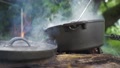 Cast Iron Dutch Oven Seasoning Cooking Smoking Camp Fire Slow Motion Hand