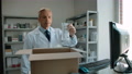Pond5 Pharmacist collects order in a box at a pharmacy for online buyer