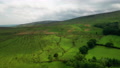 Aerial Shot Lowering Towards The Lush Green Hills Located In The English