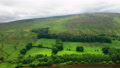 Aerial Shot Of A Green Mountain In The English Lake District Showing