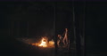 Pond5 Man and woman campfire. traveling male female camping in forest at night