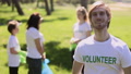 Male Volunteer Family Recycle Plastic Bottle Posing With Smile While Standing In