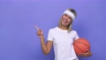 Young Basketball Player Woman Smiling And Pointing Aside, Showing Something At
