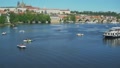 Panoramic Shot Of Prague And Pedal Boats On Vltava