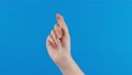 Female Hand With Snapping Fingers On Blue Screen Background.