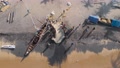 Aerial Top Down View Of Fishermen At The Coast Of Beach Packing The
