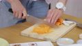 Close Up Female Cook Cuts Fresh Carrot Into Slices, Cooking Vegan Side Dish