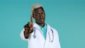 Portrait Of Serious African American Doctor In Professional Medical White Coat