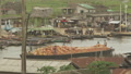 Massive Canoe Transporting Goods On A River In Benin Africa With Gondoliers