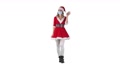 Happy Santa Claus Girl Walking And Greeting Remove Covid-19 Face Mask On White