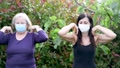 Four Women Training In The Garden Wearing Masks. Outdoor Workout During
