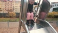 Father Helps His Daughter To Climb The Metal Slide In Playground. Family Time.
