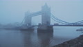 Tower Bridge With Red London Bus In Foggy And Misty Atmospheric And Moody