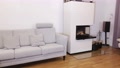 View Of Interior Of Modern Living Room. White Fireplace, Light Colored Furniture