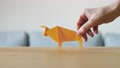 An Origami Rat Leaves And Ox Arrives On Table. New Zodiac For Chinese New Year.