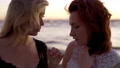 Sensual Shot Of Two Female Lesbians Looking At Each Other At Sea