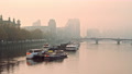 Atmospheric City In Orange Misty And Foggy Sunset With Central London City