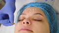 Beautician Applies Beauty Facial Cream Before Face Lifting And Cleansing