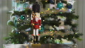 Nutcracker Soldier Wide Shot In Front Of Christmas Tree