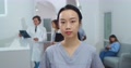 Close Up Portrait Of Asian Beautiful Female Hospital Assistant Standing In
