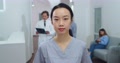 Close Up Portrait Of Asian Beautiful Female Nurse In Good Mood Standing In