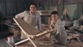 Father And Son With Diy Chair