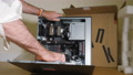 Pond5 Showing components cpu nvme front view of young man unboxing of a new