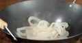 Squid Rings Are Put In A Frying Pan.