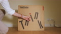 Young Man Performing The Unboxing Of A New Thinkstation Workstation