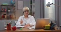 Professional Female School Teacher In Glasses Using Laptop To Video Conference