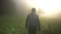 Confident Young Man Walking In Nature On Misty Morning At Sunrise, Medium