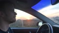 Scenic View Of Sunrise-Sunset View From Window Hands Of Car Driver On