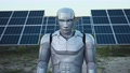 Portrait Cybernetic Prototype Robot Looking At Camera Standing On Solar Field