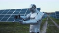 Future Cyber Robot Interacting Virtual Reality On Solar Farm. Ai Cyborg Creating