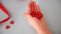 Child's Hands Holding Heart Candy In A Hand. Valentines And Mother Day Concept.