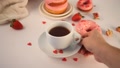 Doughnuts On The Plate. Valentine's Day Concept. Woman Hand Put A Cup Of Tea On