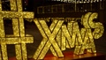 Quick Pan Passing By A Giant Ornamental Led Christmas Xmas Letter Sign