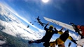 Many Skydivers Jumping Out Of Two Airplanes.