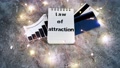 Law Of Attraction Notepad With Text Next To Credit Cards And Positive Stats S