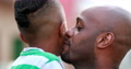 Father And Child Love Care And Affection. African Ethnicity Dad Kissing Son