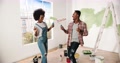 Happy African American Young Couple Having Fun, Dancing And Singing On Roller