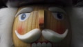 Macro Shot Of Wooden Christmas Nutcracker, Face Of A Festive Toy Soldier