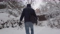 Winter Wonderland Guy Walking In Minehaha Falls After A Snow Storm In
