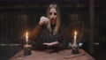 Young Witch Female Fortune Teller Uses Needle With Thread To Magic Divination