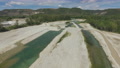 Drone Flies Towards Over A Dry River In France
